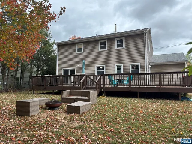 a view of a chairs setting on the roof deck