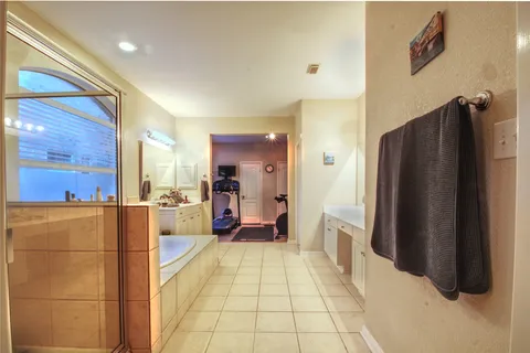 a large bathroom with a glass door shower