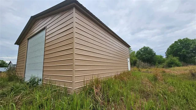 a view of a house with a small yard