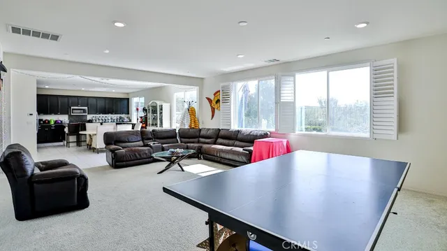 a kitchen with granite countertop stainless steel appliances a refrigerator and a sink