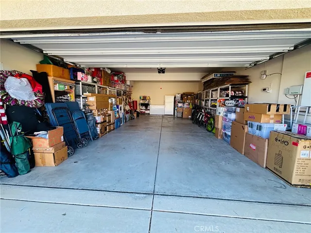 a view of a backyard with sitting area and garden