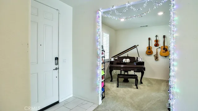 a bedroom with a bed and a dresser in it