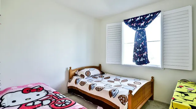 a bedroom with a bed and a table