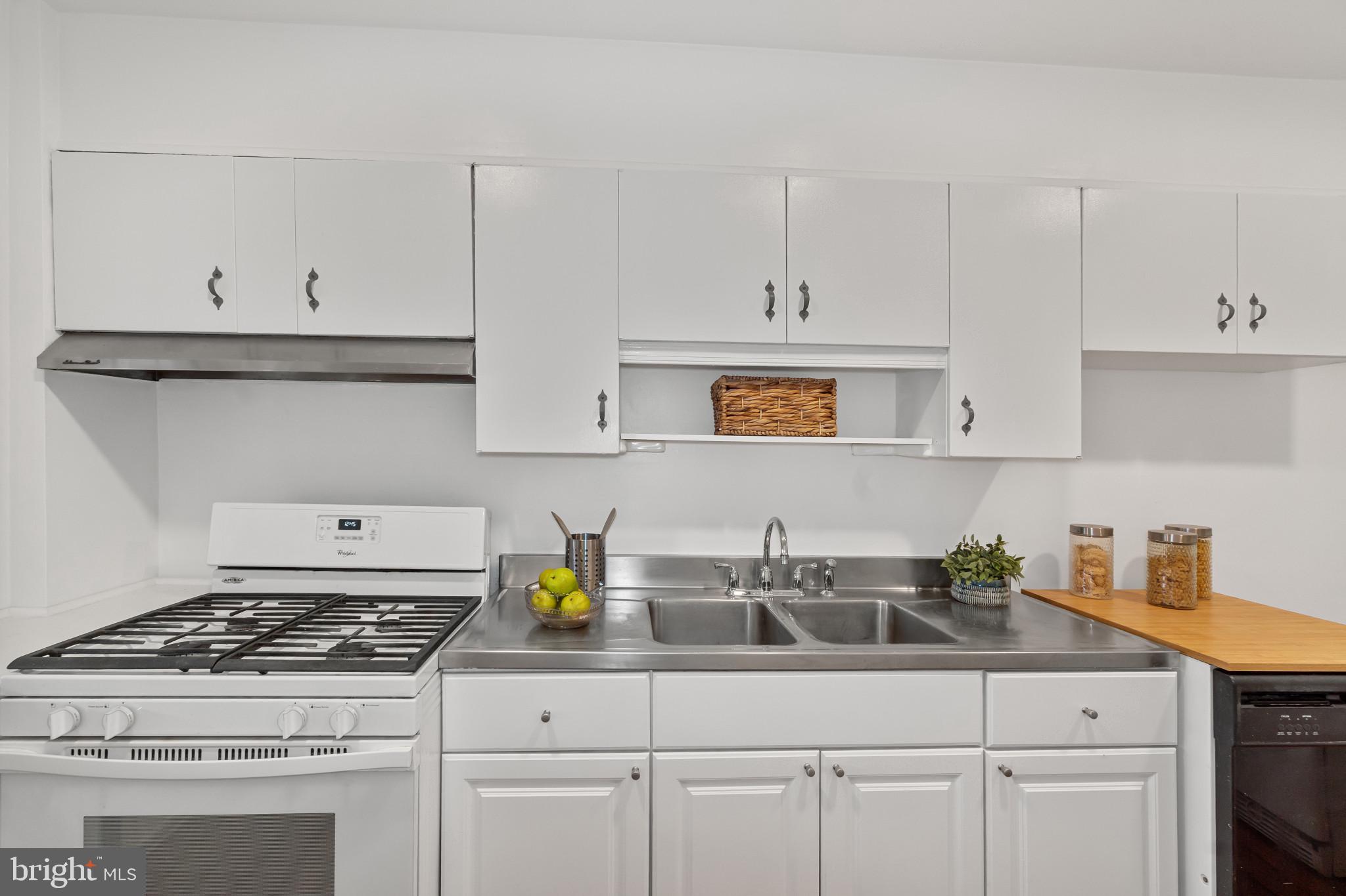 308 Greenlow Road Catonsville, MD 21228 - Photo 12 of 33 a kitchen with white cabinets and appliances