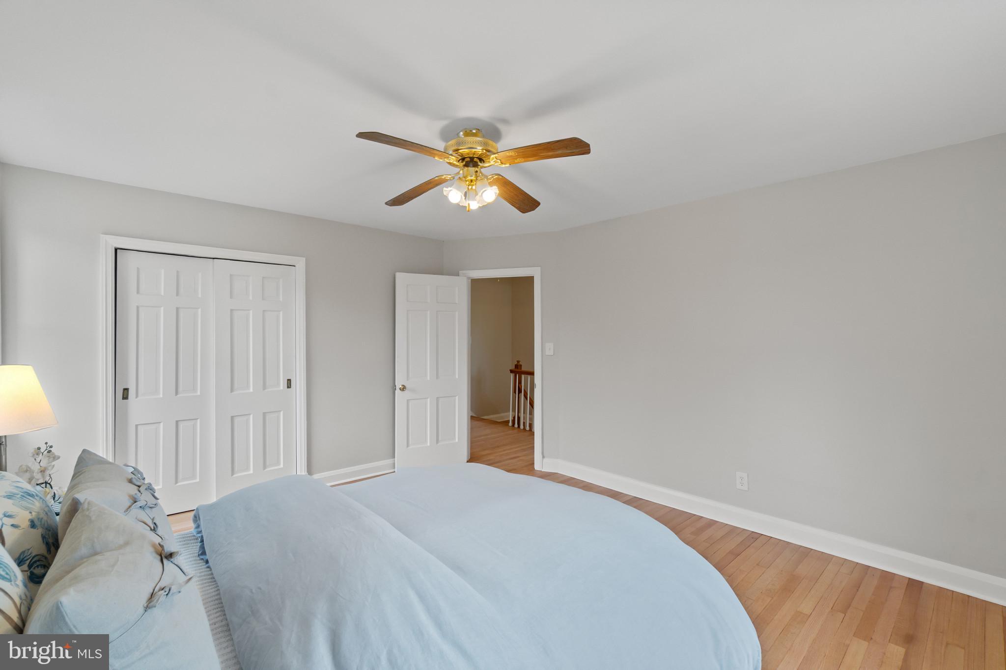 308 Greenlow Road Catonsville, MD 21228 - Photo 16 of 33 a bedroom with a bed and a chandelier fan