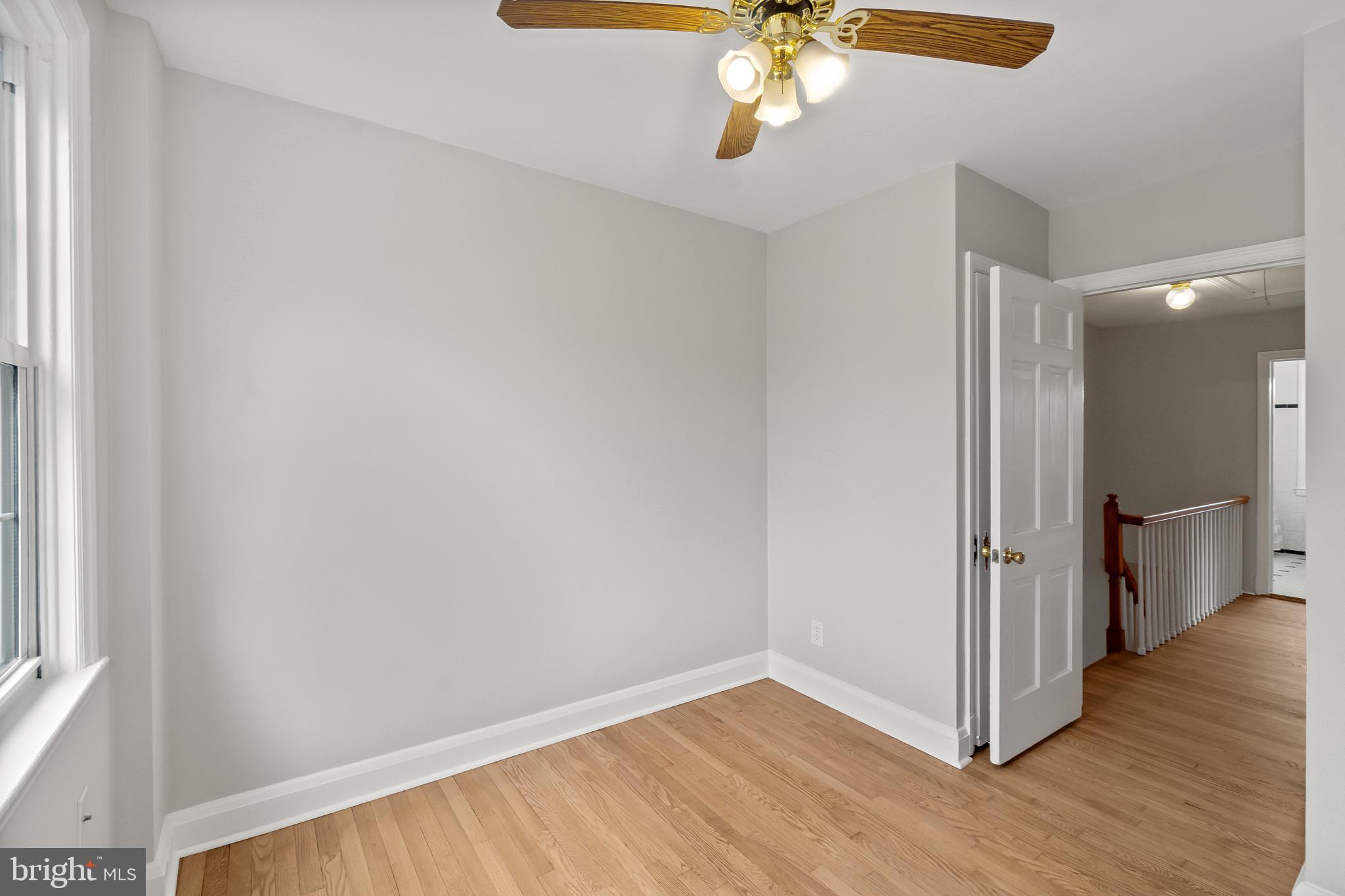 308 Greenlow Road Catonsville, MD 21228 - Photo 18 of 33 wooden floor in an empty room with a window