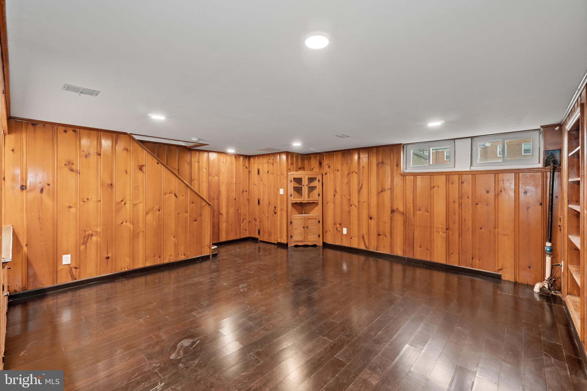 308 Greenlow Road Catonsville, MD 21228 - Photo 24 of 33 a view of an empty room with wooden floor and a window