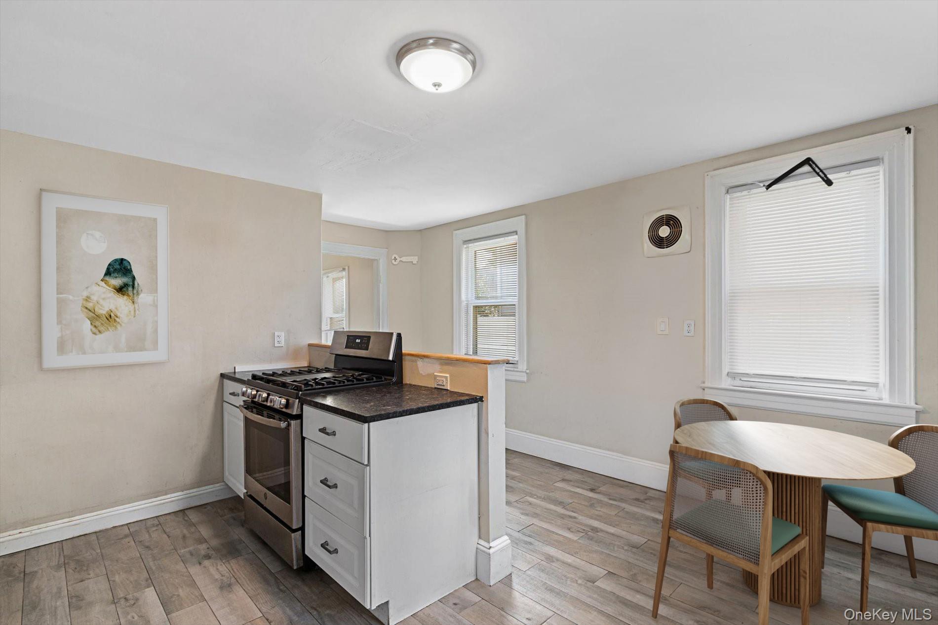 20 Waldo Avenue Greenvale, NY 11548 - Photo 4 of 10 a kitchen that has a stove and a table in it