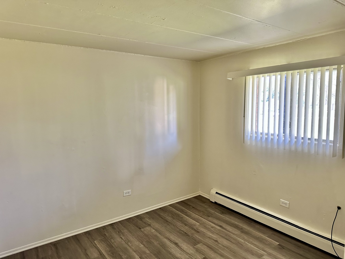 250 North Entrance Avenue, Unit 3A Kankakee, IL 60901 - Photo 5 of 6 a view of a room with wooden floor and a window