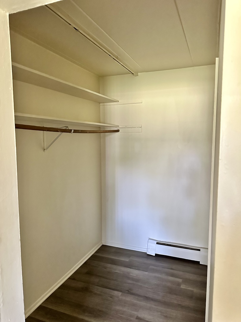 250 North Entrance Avenue, Unit 3A Kankakee, IL 60901 - Photo 6 of 6 a view of an empty room with wooden floor and a window