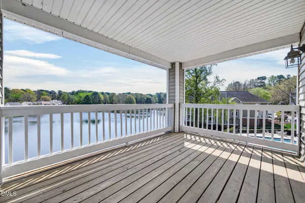 a view of balcony with wooden floor