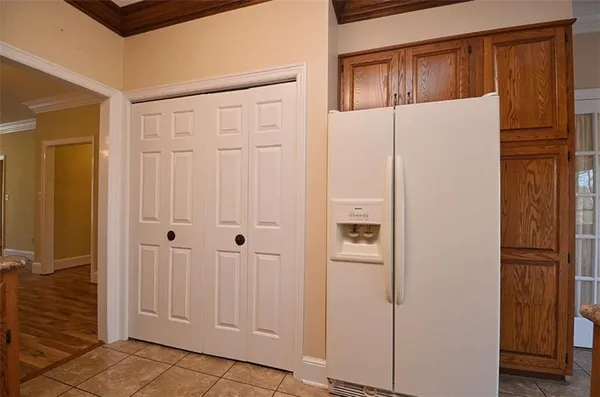 a white refrigerator freezer sitting inside of a kitchen