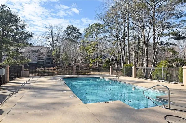 a view of a lake with a house in the background