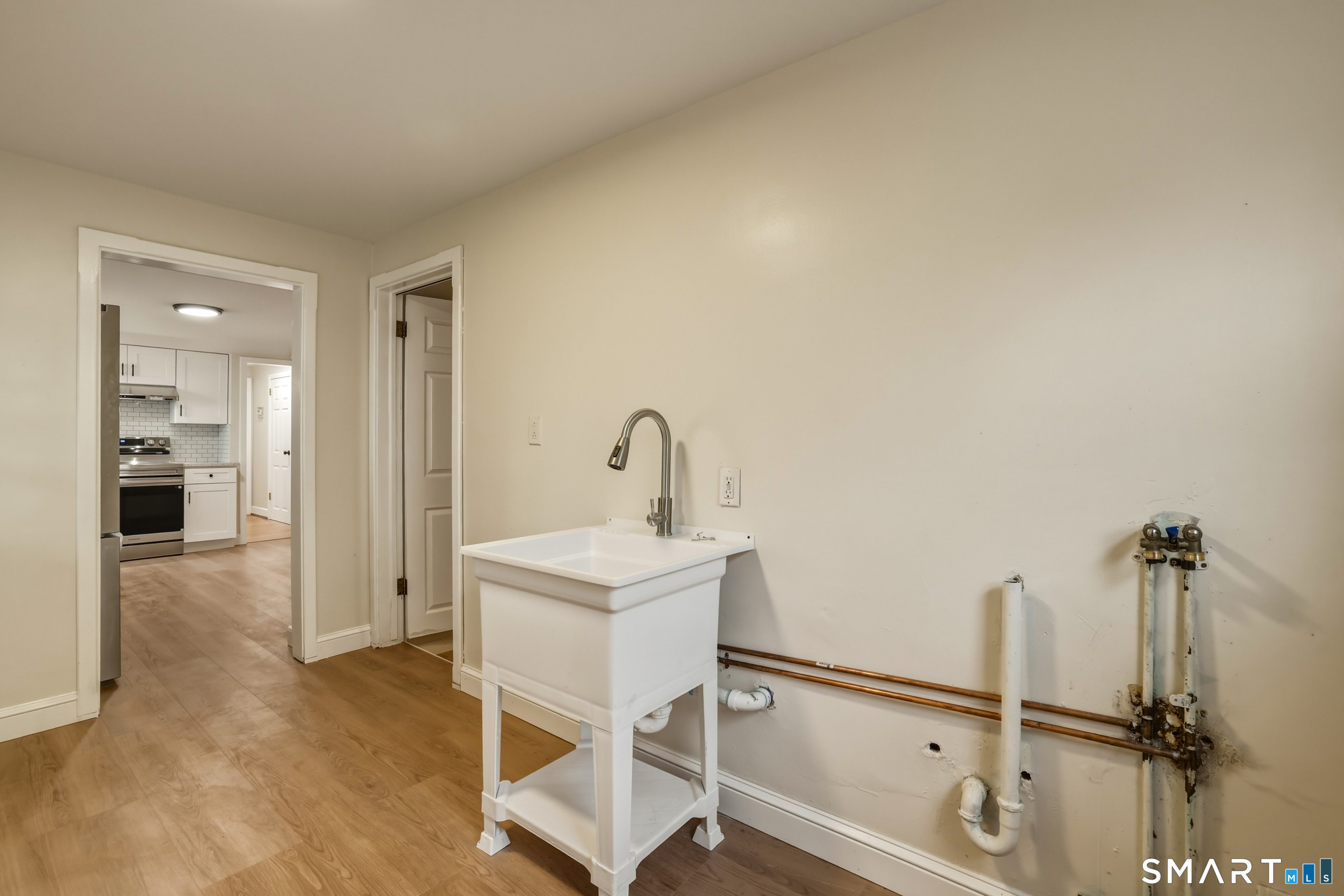 102 Lawler Road West Hartford, CT 06117 - Photo 14 of 42 a bathroom with a sink and mirror