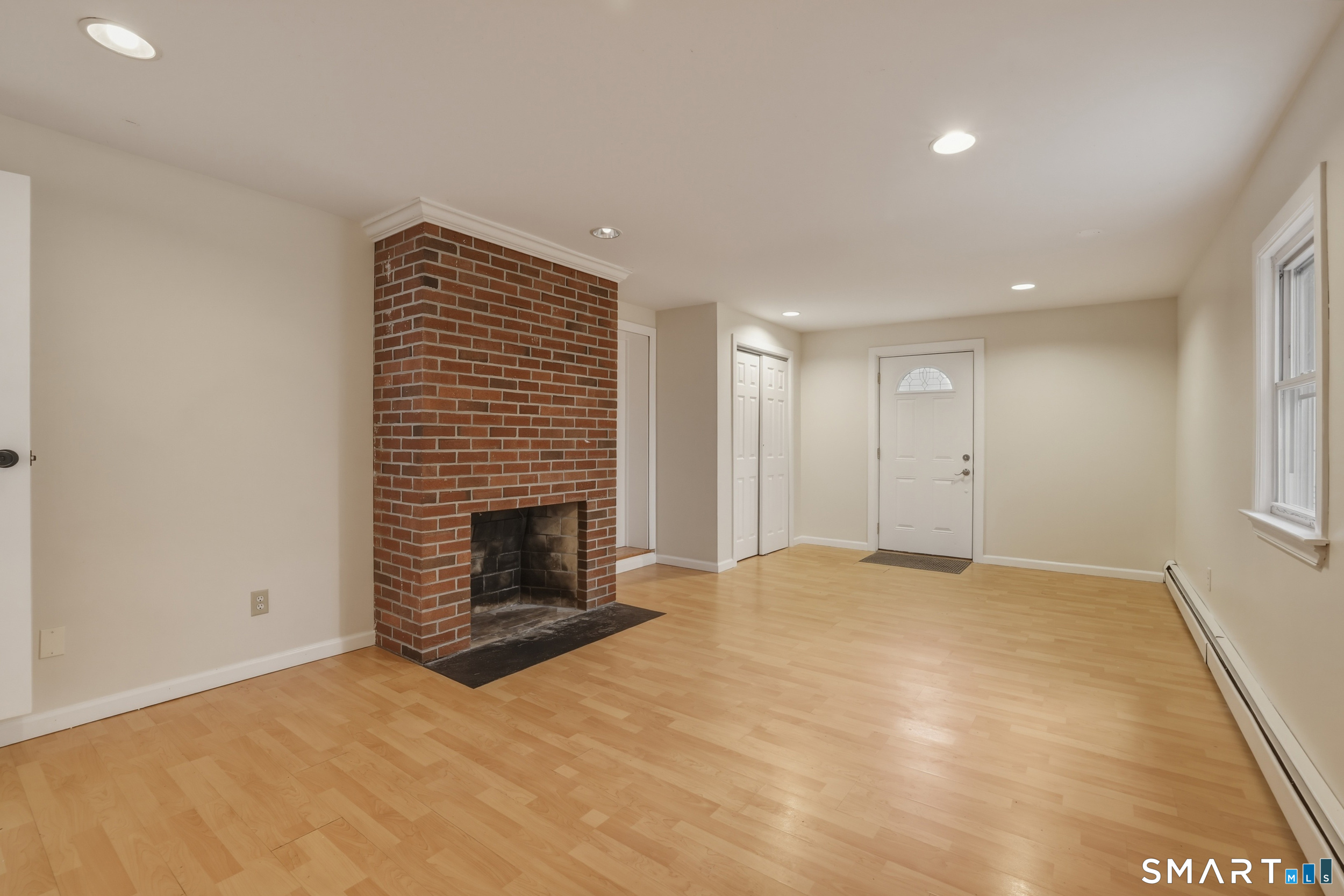 102 Lawler Road West Hartford, CT 06117 - Photo 15 of 42 a view of an empty room with a fireplace