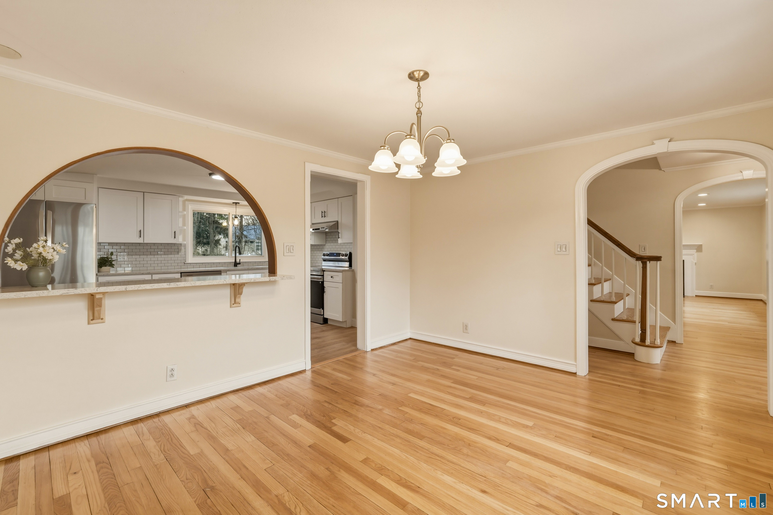 102 Lawler Road West Hartford, CT 06117 - Photo 3 of 42 a view of a livingroom with wooden floor