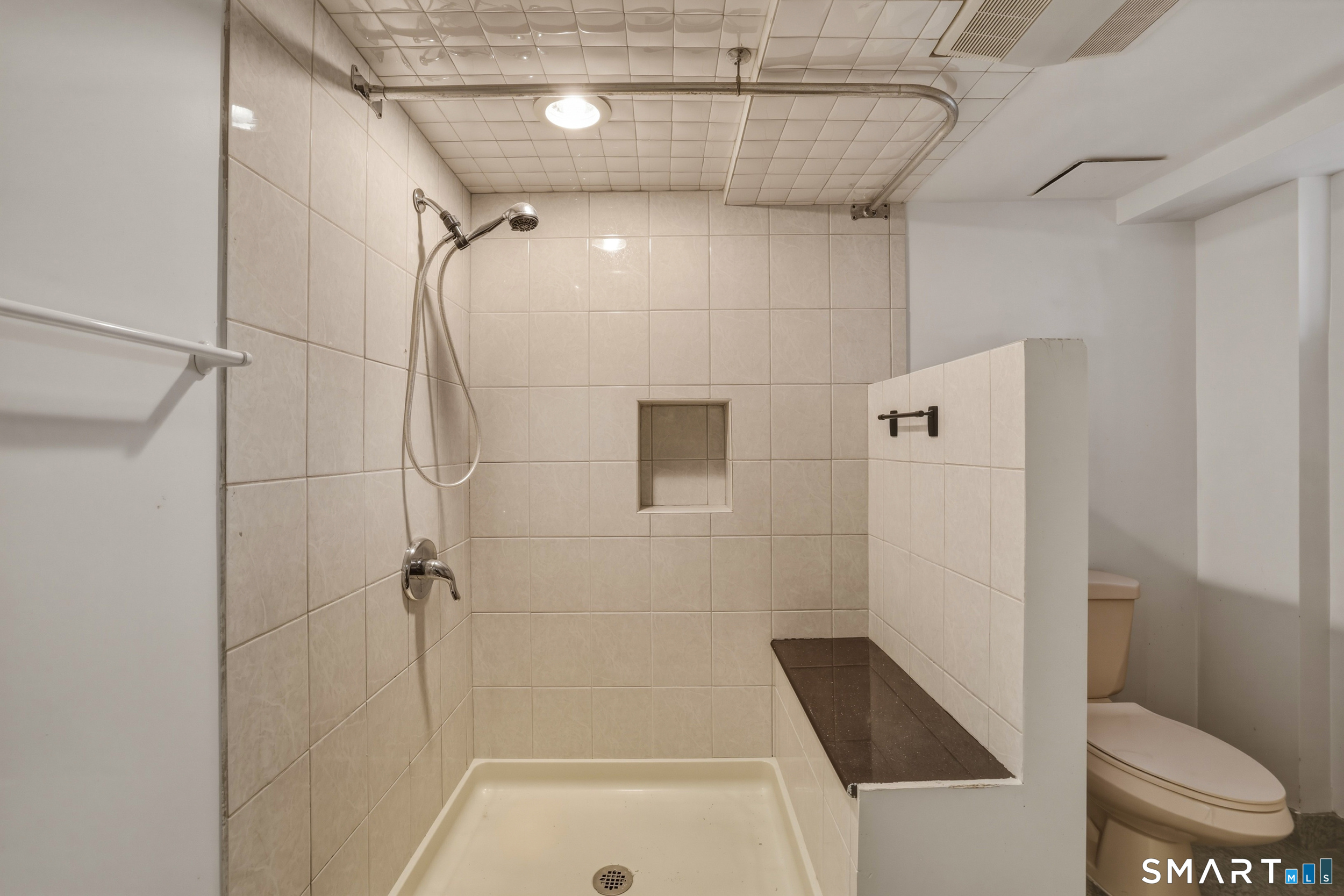 102 Lawler Road West Hartford, CT 06117 - Photo 32 of 42 a bathroom with a shower and toilet