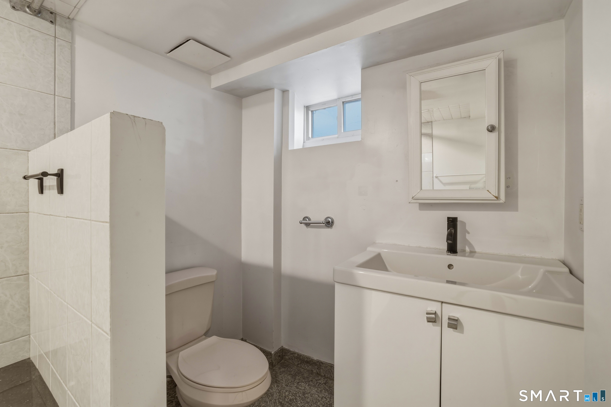 102 Lawler Road West Hartford, CT 06117 - Photo 34 of 42 a bathroom with a sink toilet and vanity