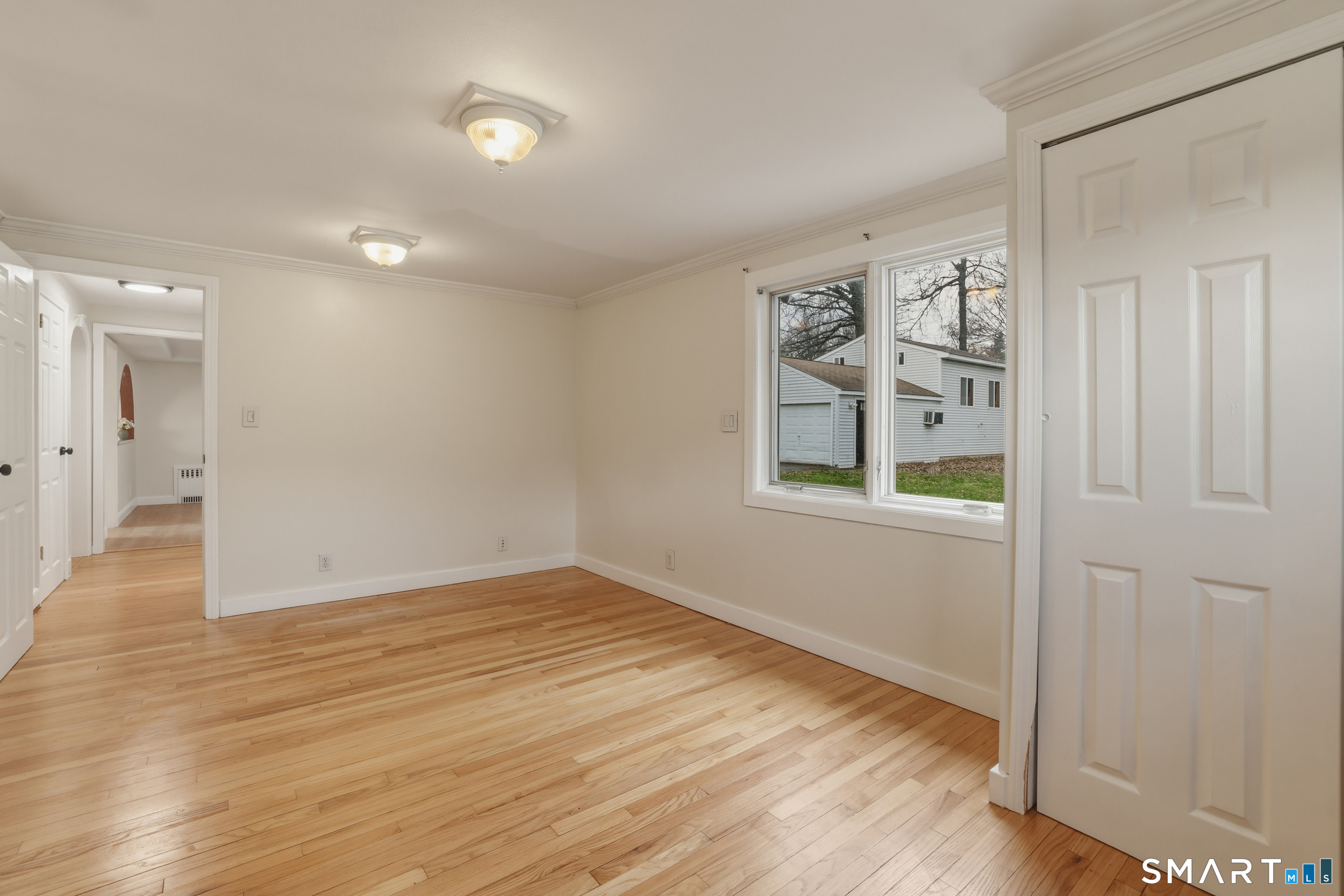 102 Lawler Road West Hartford, CT 06117 - Photo 10 of 42 wooden floor in an empty room with a window
