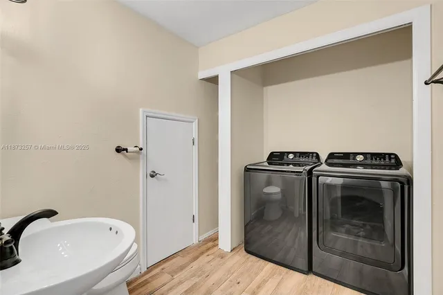 a utility room with washer and dryer