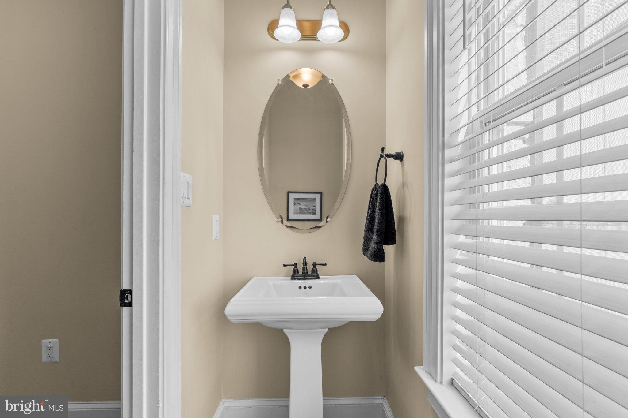 7251 Annapolis Rock Road Gaithersburg, MD 20882 - Photo 20 of 78 a bathroom with a sink and a mirror