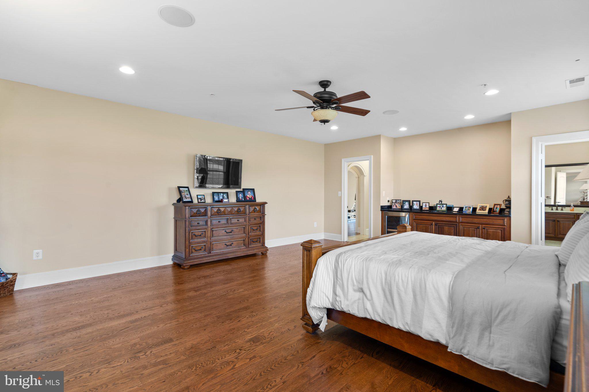 7251 Annapolis Rock Road Gaithersburg, MD 20882 - Photo 24 of 78 a spacious bedroom with a bed and a flat screen tv