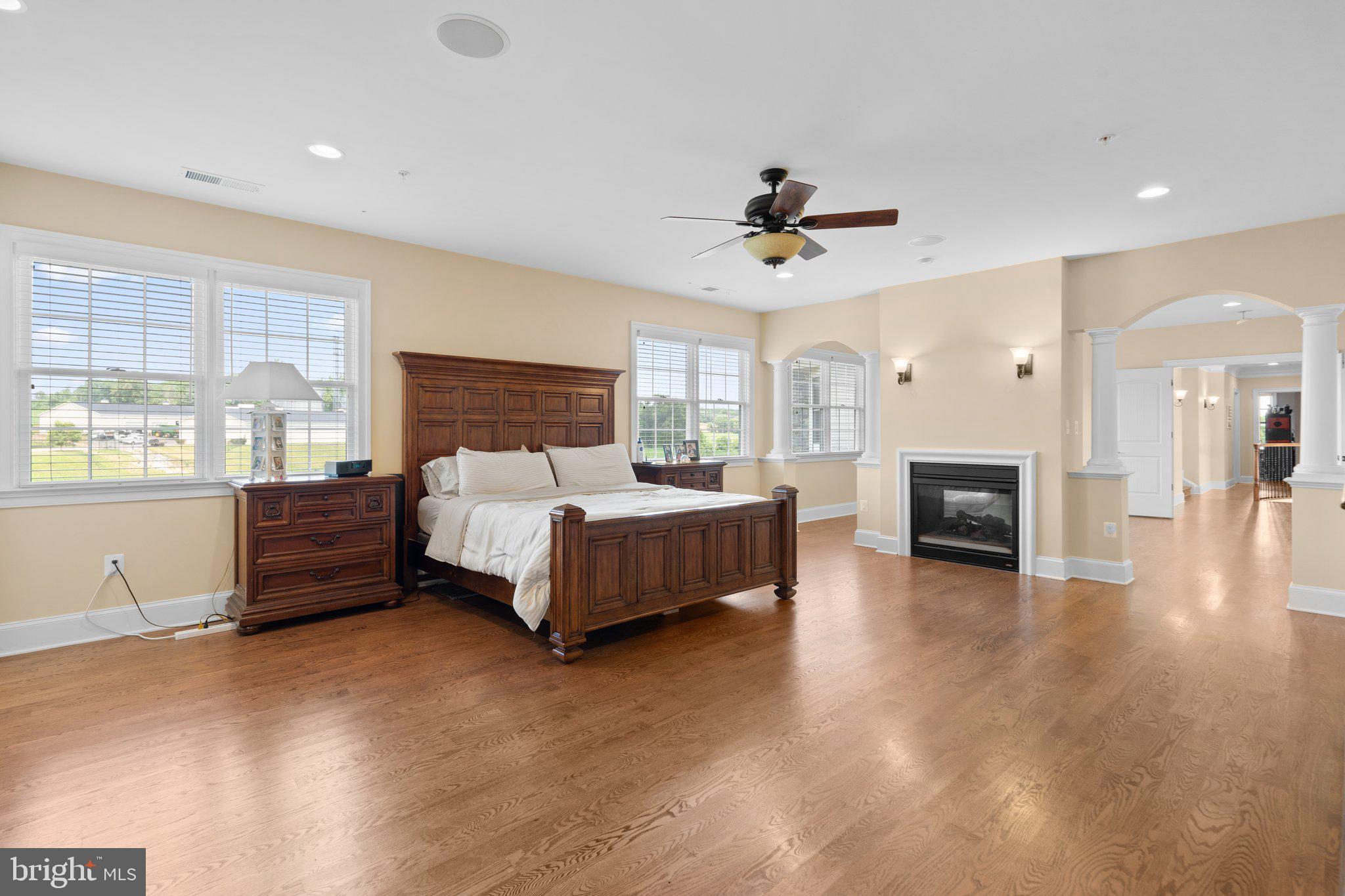 7251 Annapolis Rock Road Gaithersburg, MD 20882 - Photo 25 of 78 a spacious bedroom with a large bed a chandelier and a window