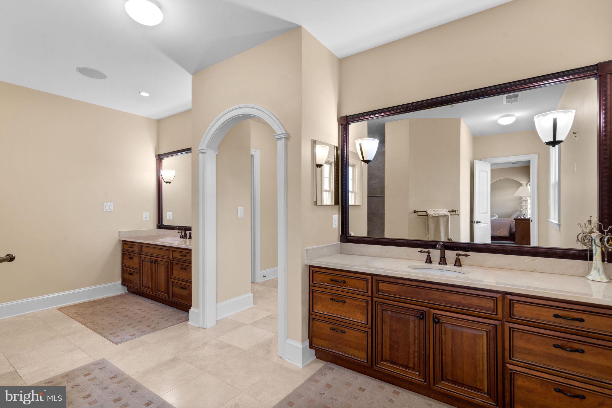 7251 Annapolis Rock Road Gaithersburg, MD 20882 - Photo 26 of 78 a spacious bathroom with a double vanity sink double and mirror