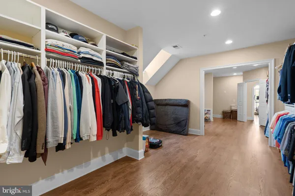 a view of storage and utility room with racks on the wall