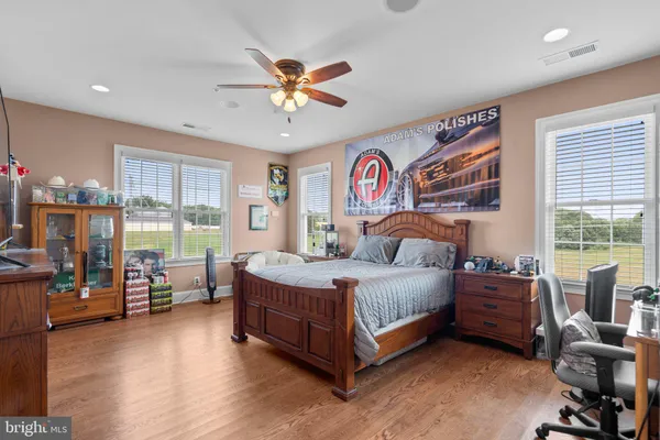 a spacious bedroom with a bed and a fireplace