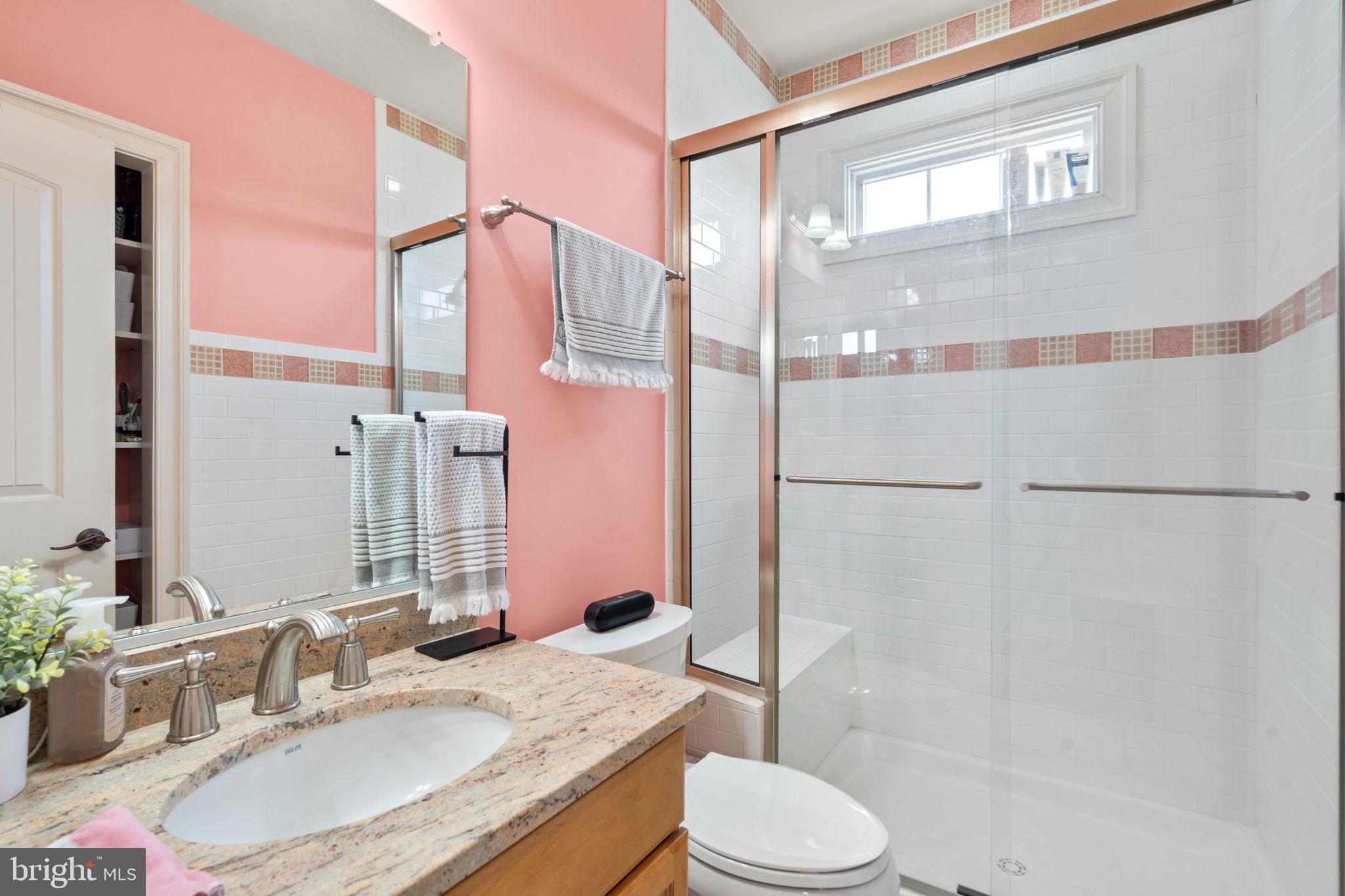 7251 Annapolis Rock Road Gaithersburg, MD 20882 - Photo 42 of 78 a bathroom with a granite countertop sink toilet and shower