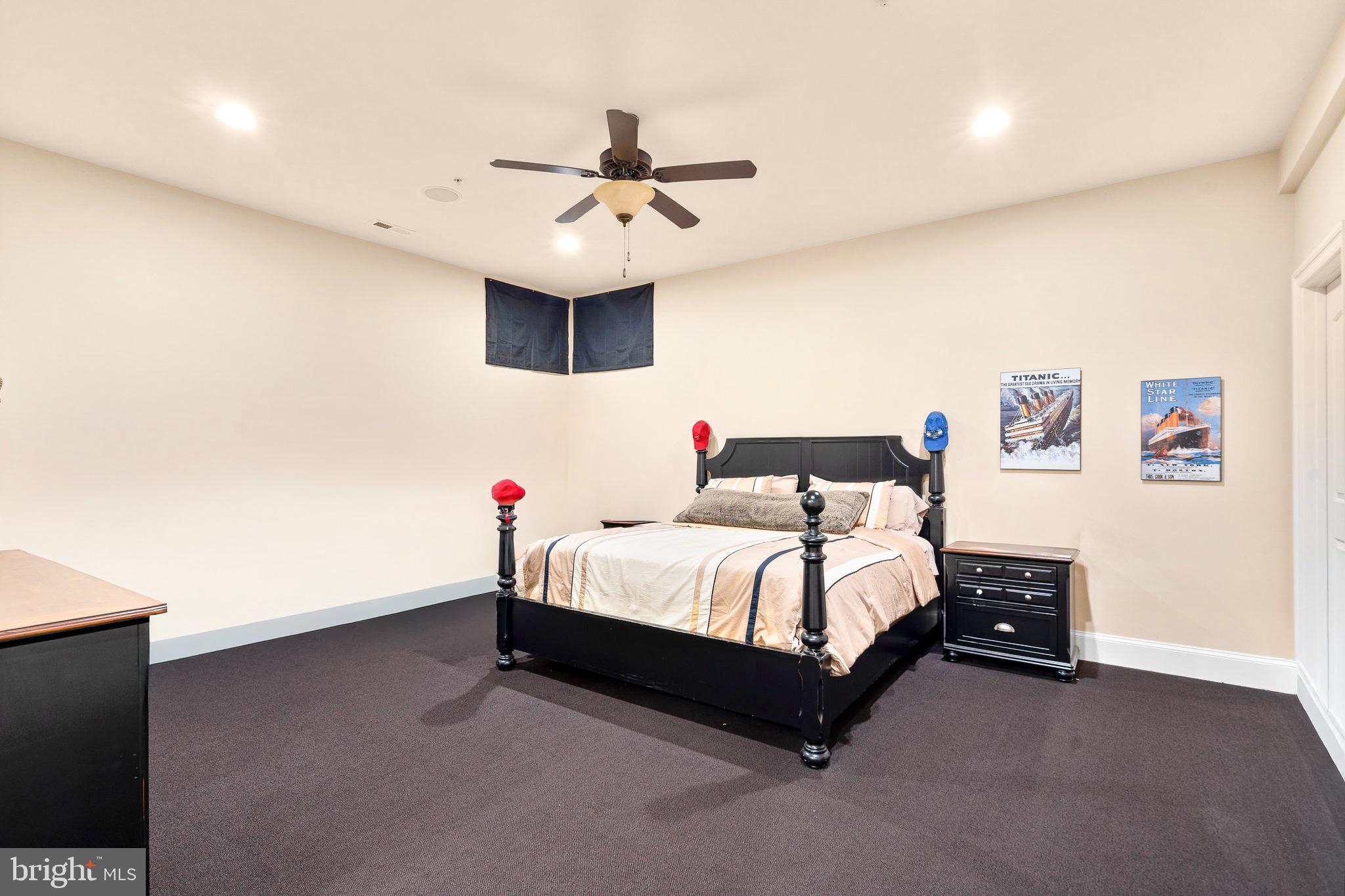 7251 Annapolis Rock Road Gaithersburg, MD 20882 - Photo 63 of 78 a bed room with a bed and a ceiling fan