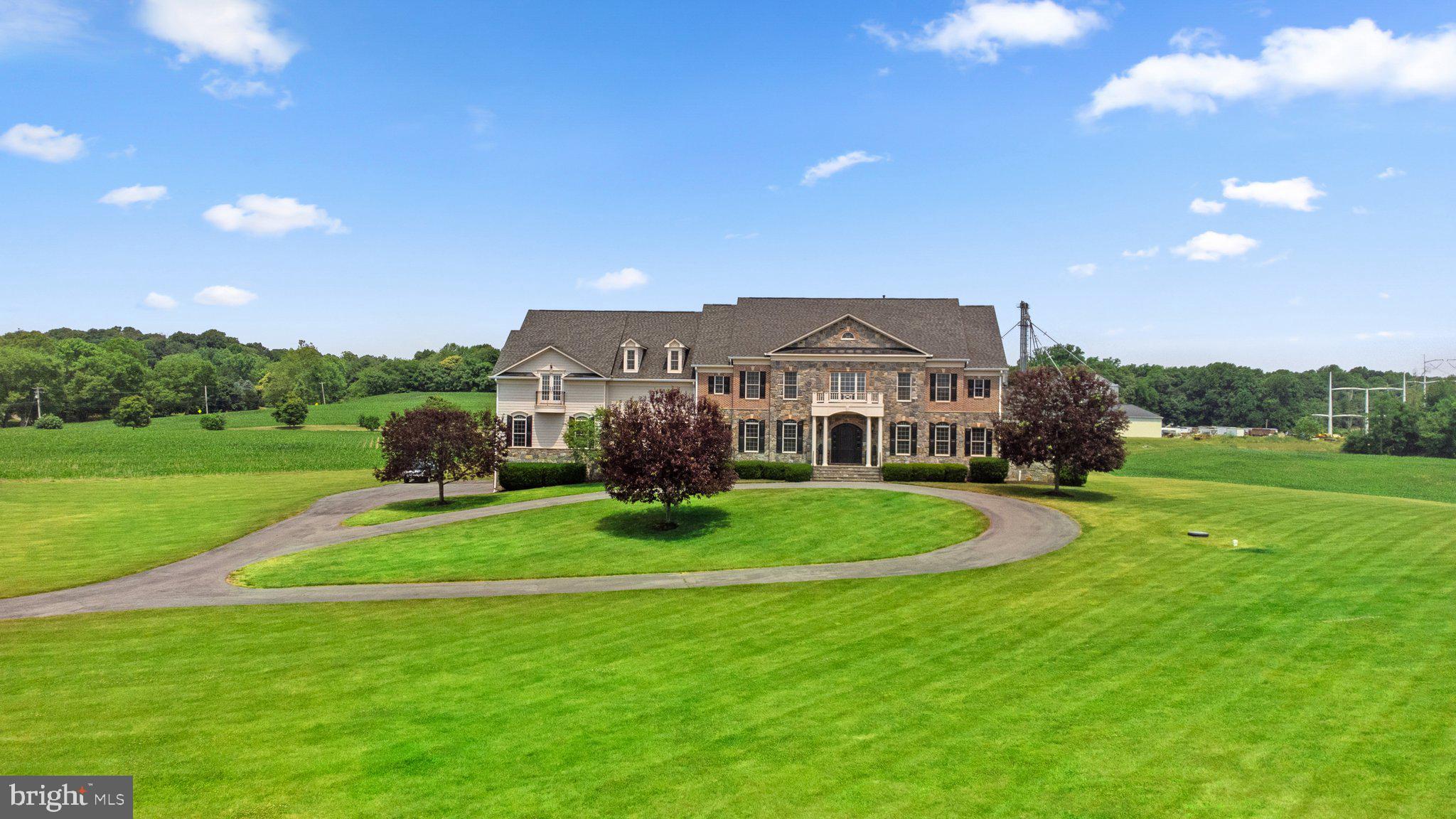 7251 Annapolis Rock Road Gaithersburg, MD 20882 - Photo 78 of 78 a view of a big house with a big yard and large trees