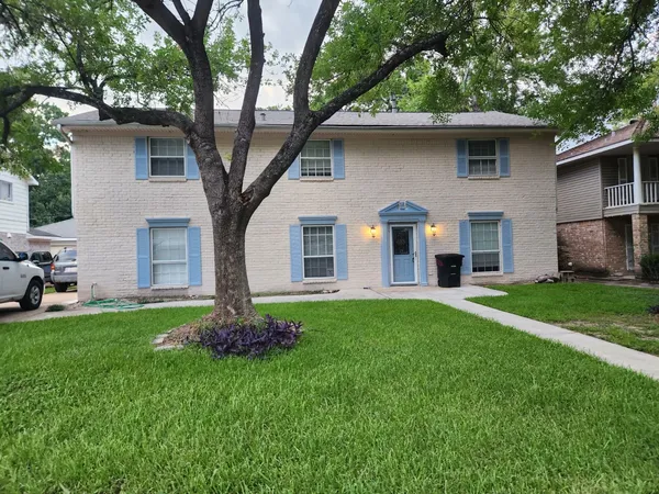 a front view of house with yard