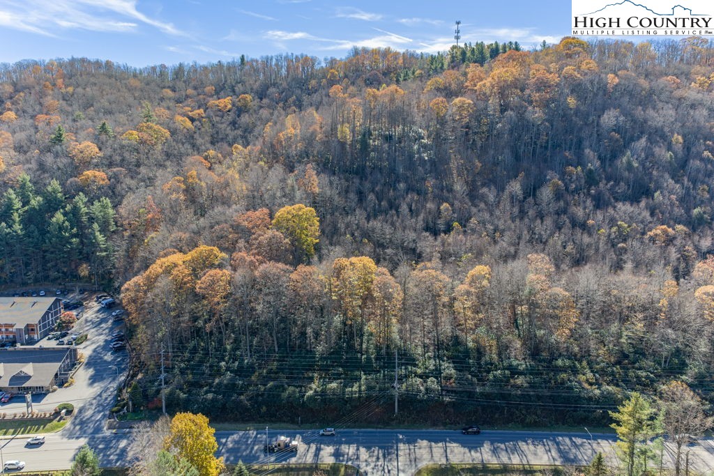 105 Highway Boone Nc 28607 Boone, NC 28607 - Photo 14 of 19 a view of a lake with a mountain in the background