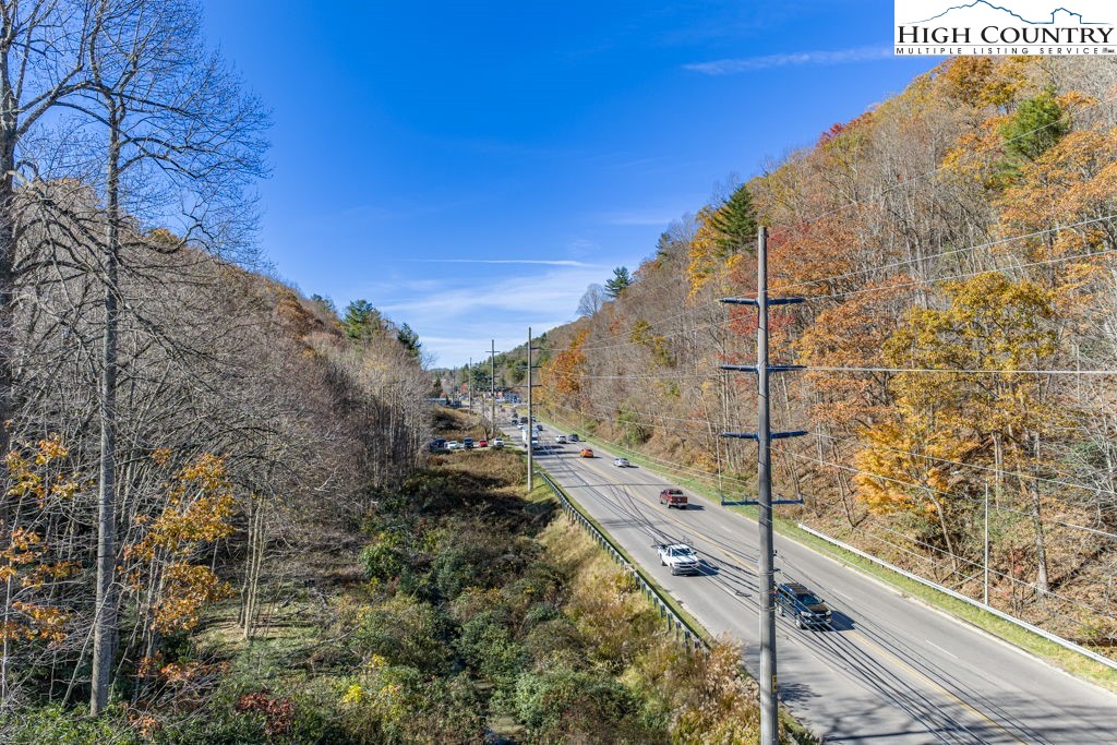 105 Highway Boone Nc 28607 Boone, NC 28607 - Photo 8 of 19 a view of balcony with wooden floor and fence