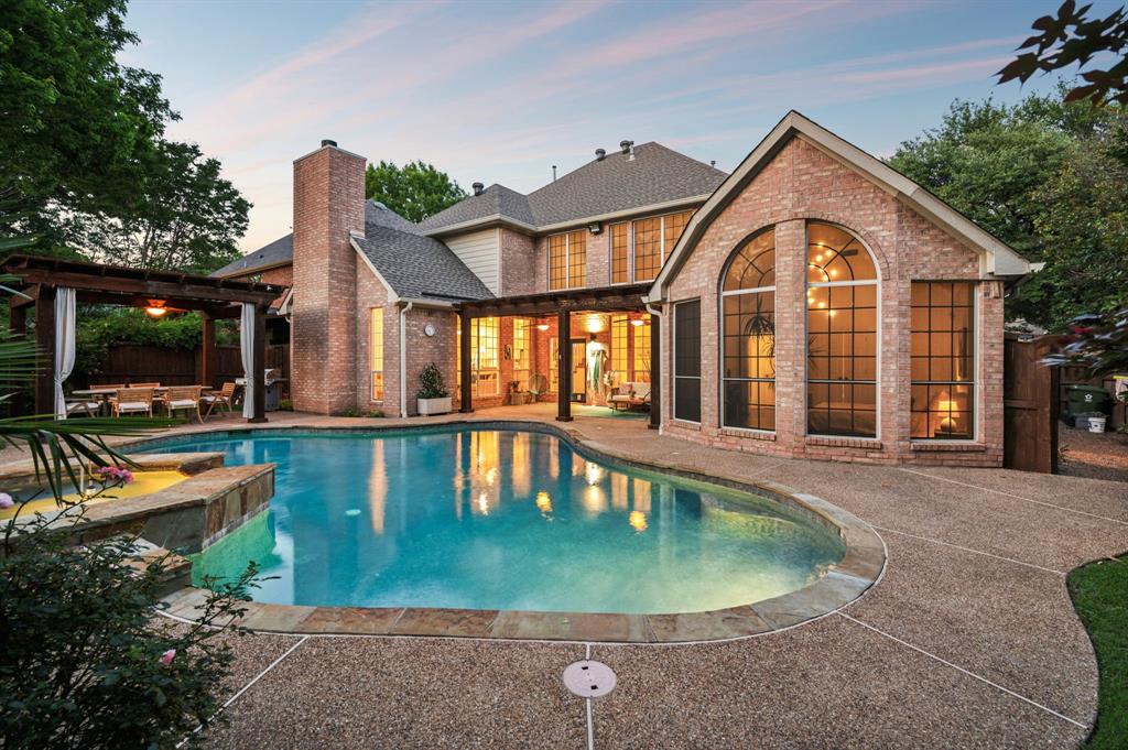 Swimming pool featuring a patio area, a pergola, and fence