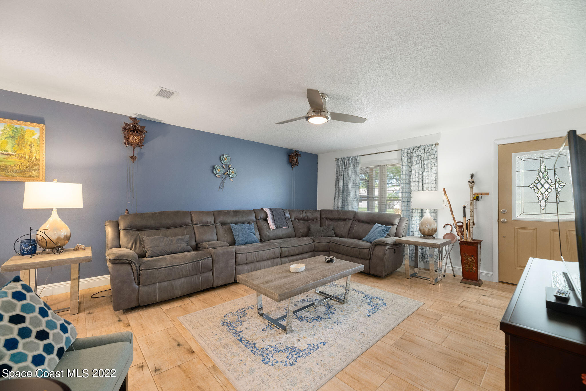 1821 Britt Road Cocoa, FL 32926 - Photo 12 of 63 a living room with furniture and a couch