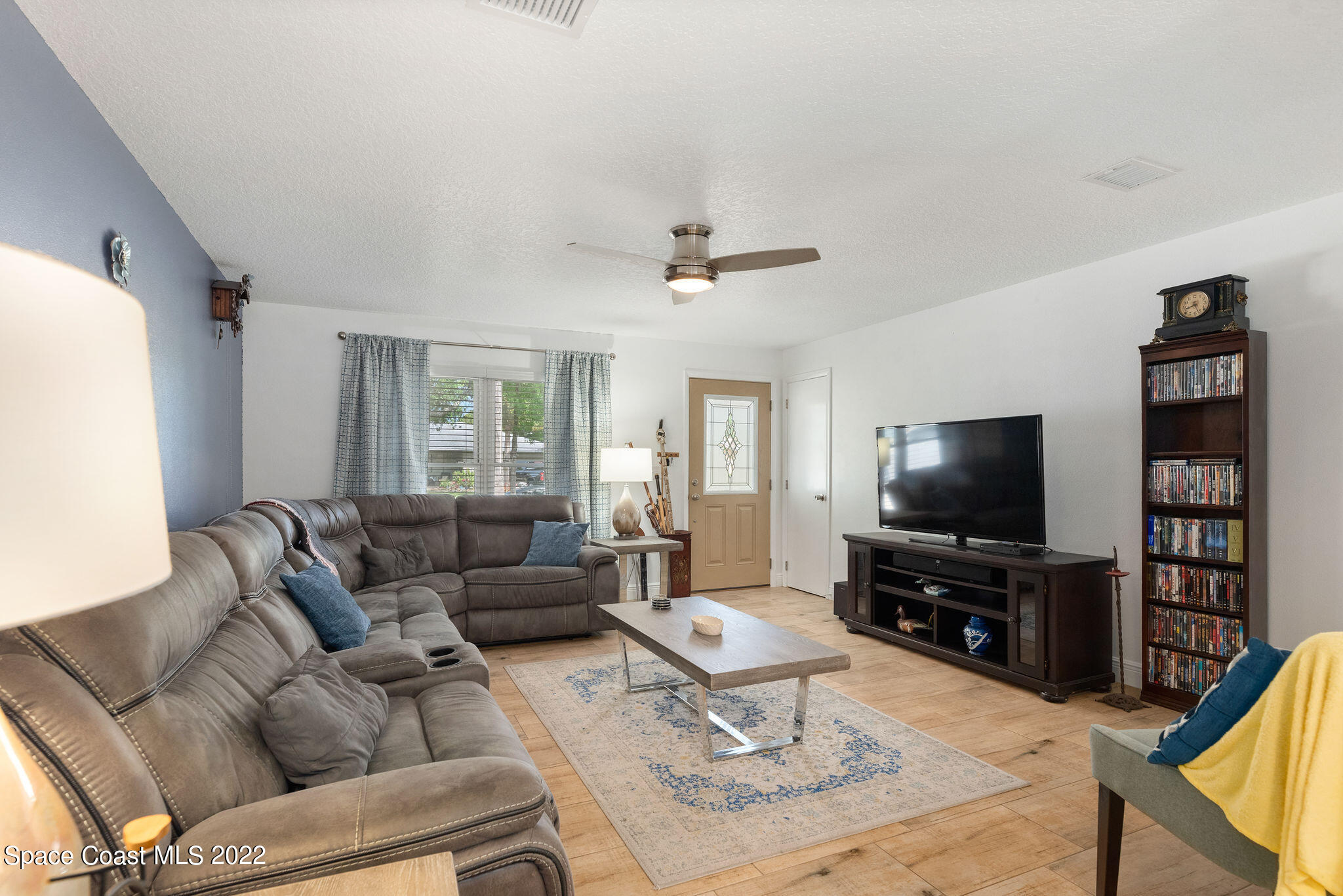 1821 Britt Road Cocoa, FL 32926 - Photo 13 of 63 a living room with furniture and a flat screen tv