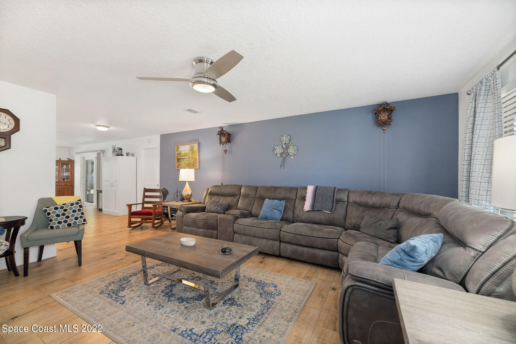 1821 Britt Road Cocoa, FL 32926 - Photo 14 of 63 a living room with furniture and a large window