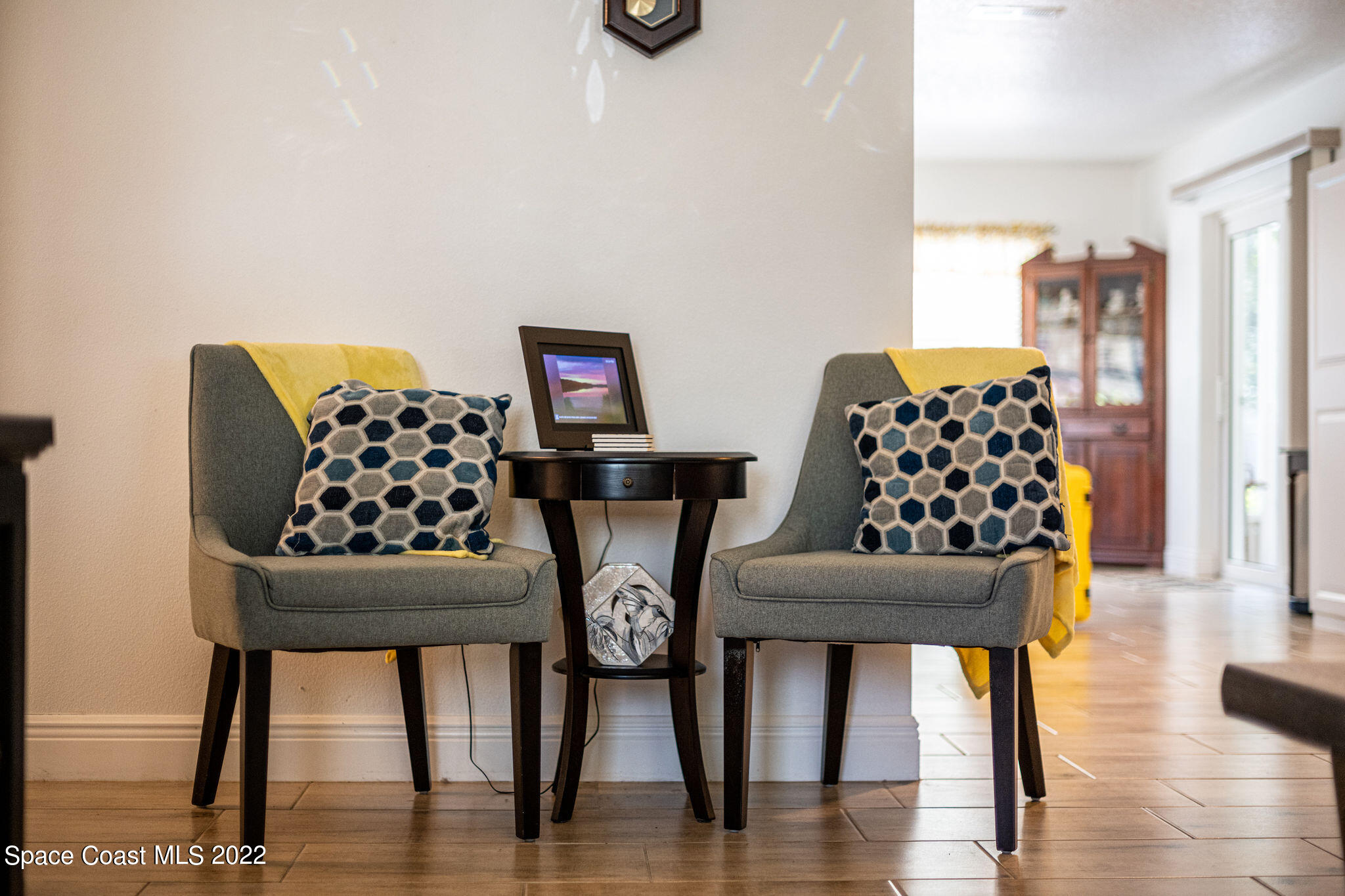 1821 Britt Road Cocoa, FL 32926 - Photo 16 of 63 a bedroom with furniture and wooden floor