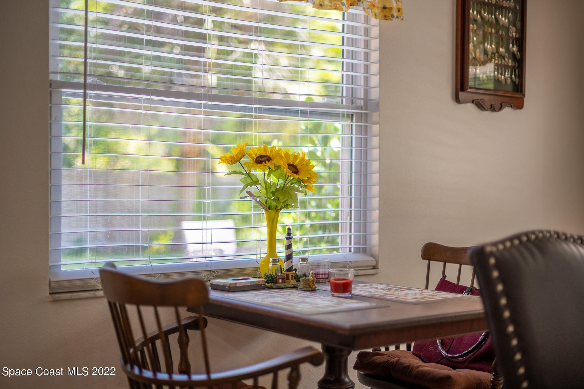 1821 Britt Road Cocoa, FL 32926 - Photo 26 of 63 a dining room with furniture and a large window