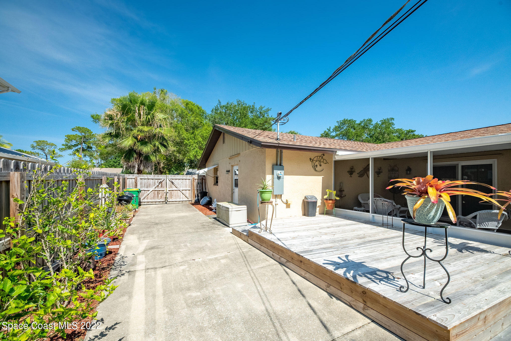 1821 Britt Road Cocoa, FL 32926 - Photo 36 of 63 a house view with a seating space and garden