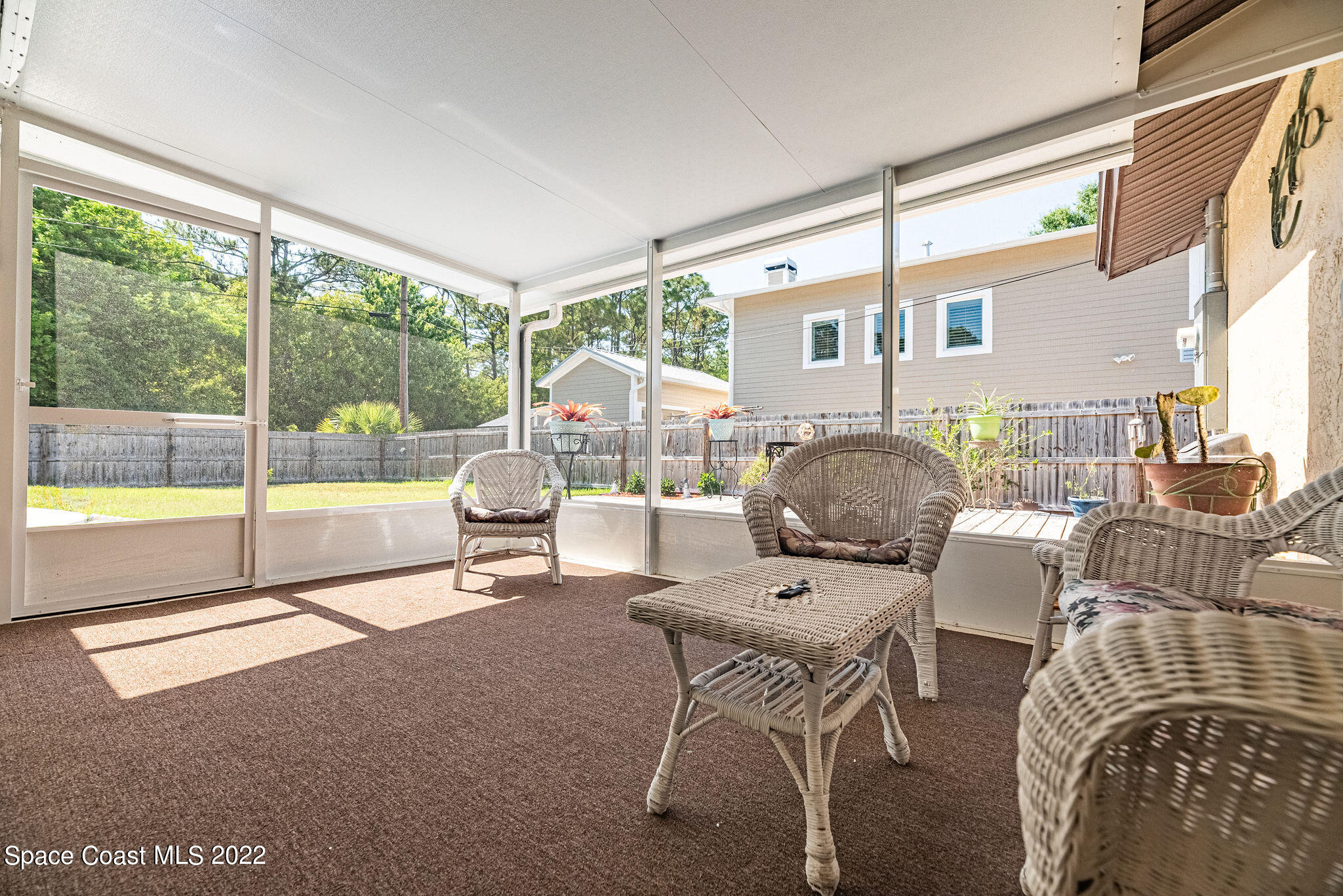 1821 Britt Road Cocoa, FL 32926 - Photo 39 of 63 a living room with furniture and large windows