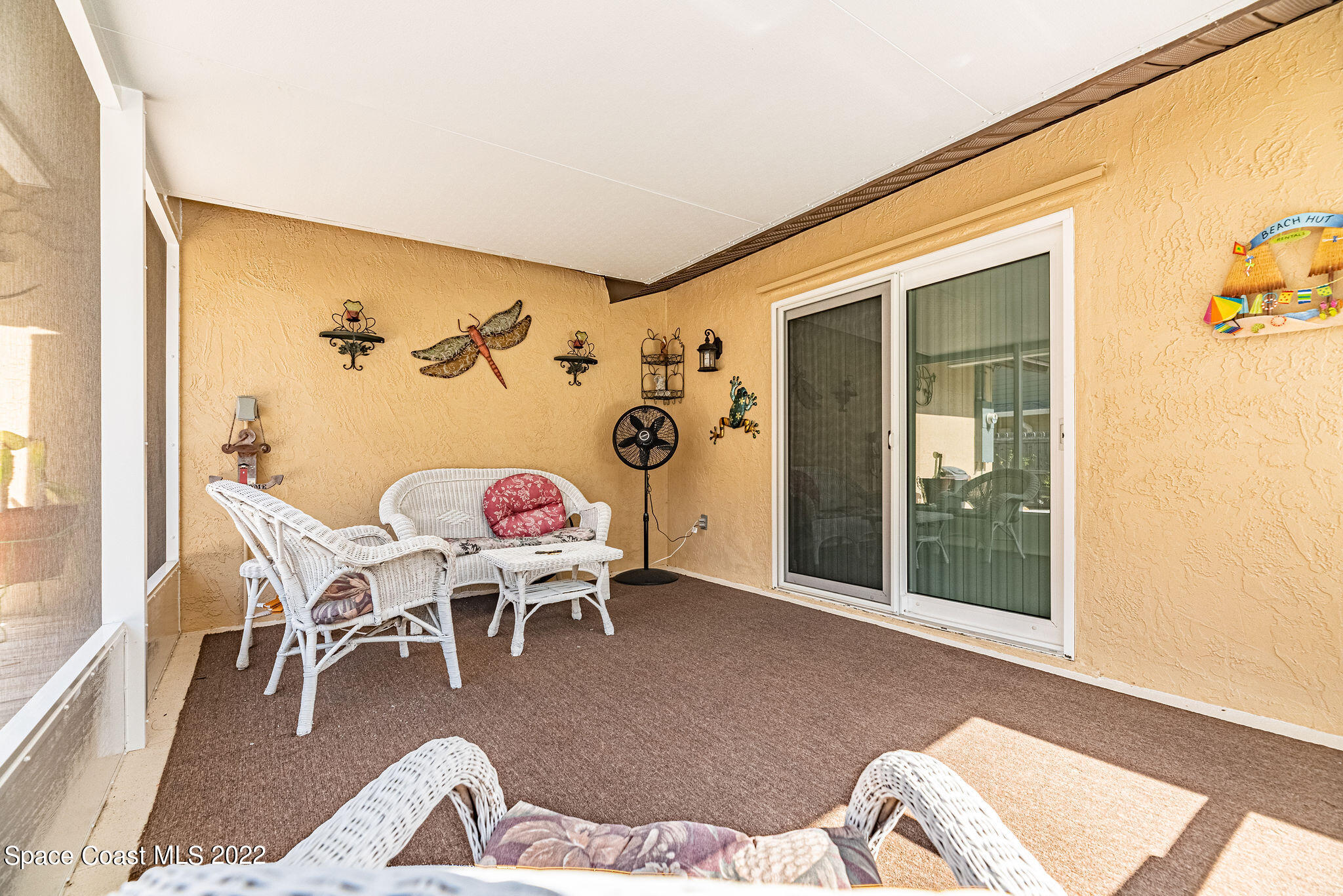 1821 Britt Road Cocoa, FL 32926 - Photo 40 of 63 a living room with furniture and wooden floor