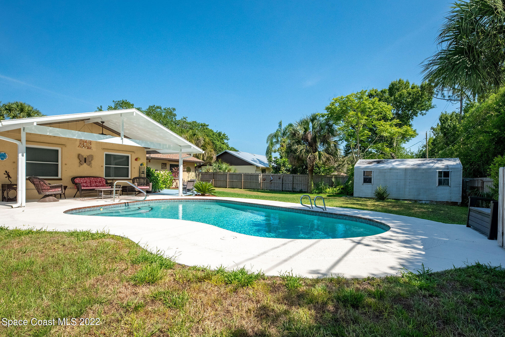 1821 Britt Road Cocoa, FL 32926 - Photo 43 of 63 a view of a house with backyard and sitting area