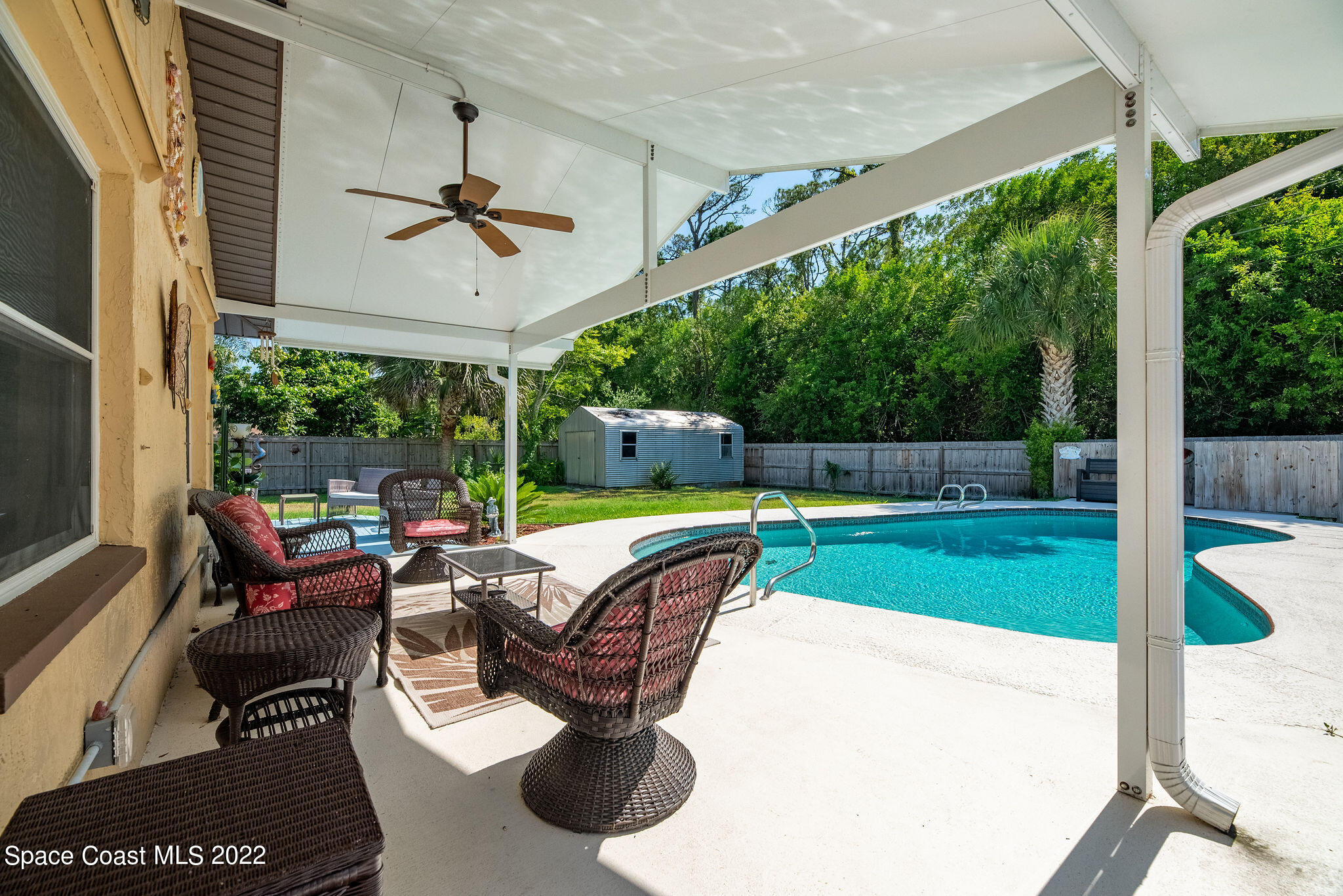 1821 Britt Road Cocoa, FL 32926 - Photo 49 of 63 a view of a porch with furniture and a yard