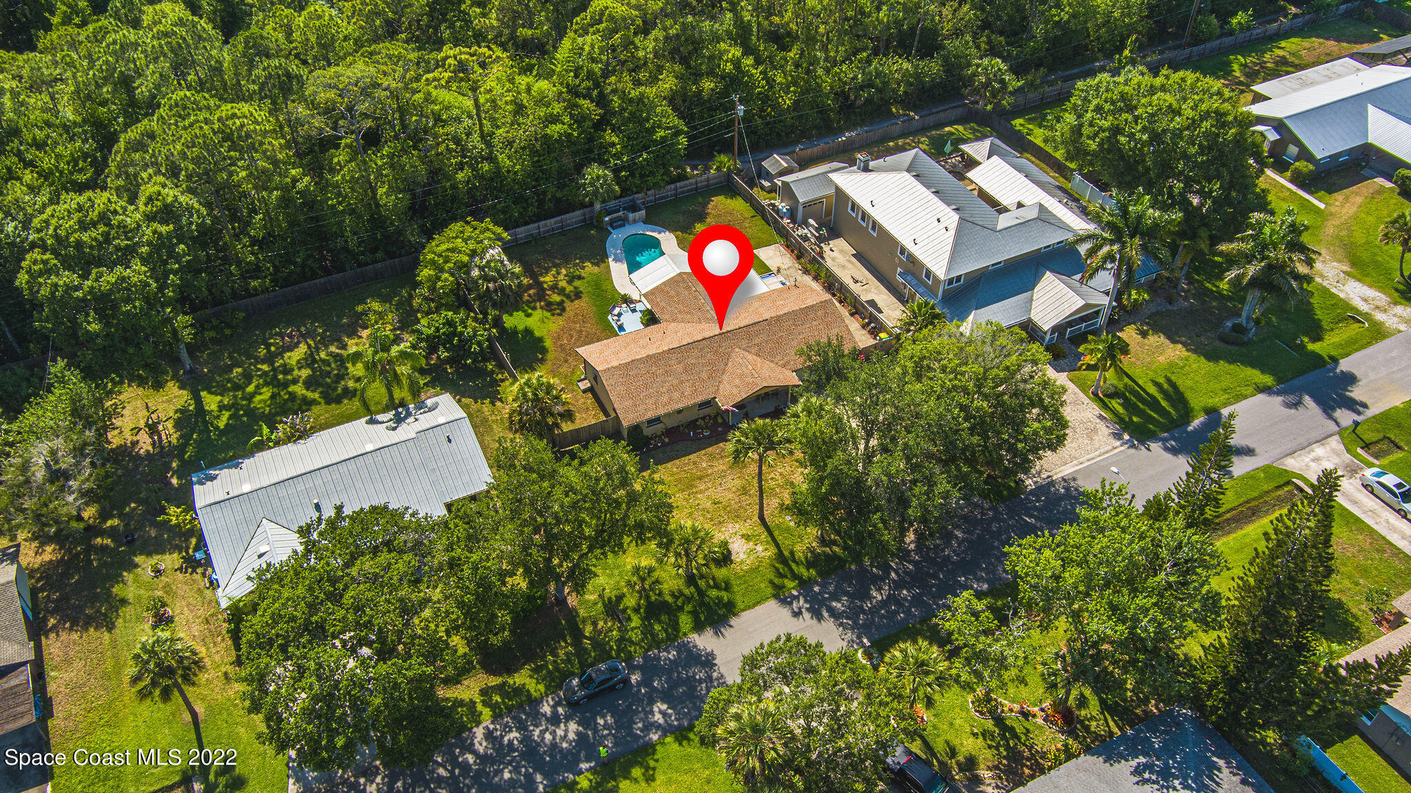 1821 Britt Road Cocoa, FL 32926 - Photo 62 of 63 an aerial view of a house with a yard and garden