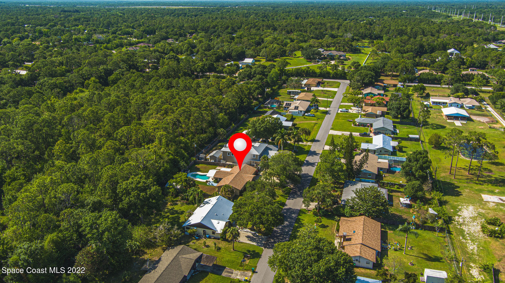 1821 Britt Road Cocoa, FL 32926 - Photo 63 of 63 an aerial view of residential houses with outdoor space and trees