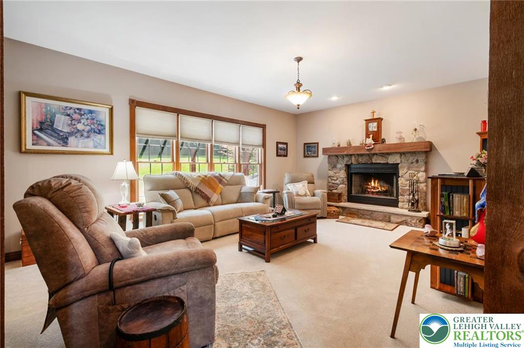 1222 Spring Road Andreas, PA 18211 - Photo 19 of 44 An inviting stone fireplace serves as
the focal point of this comfortable
living space.